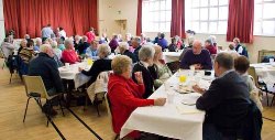 Senior citizens enjoy lunch during the Unmasked week.